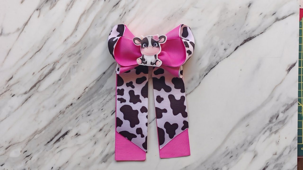 MOÑO CON COLITAS ELABORADO CON LISTÓN DE 3.8CM DE ANCHO 