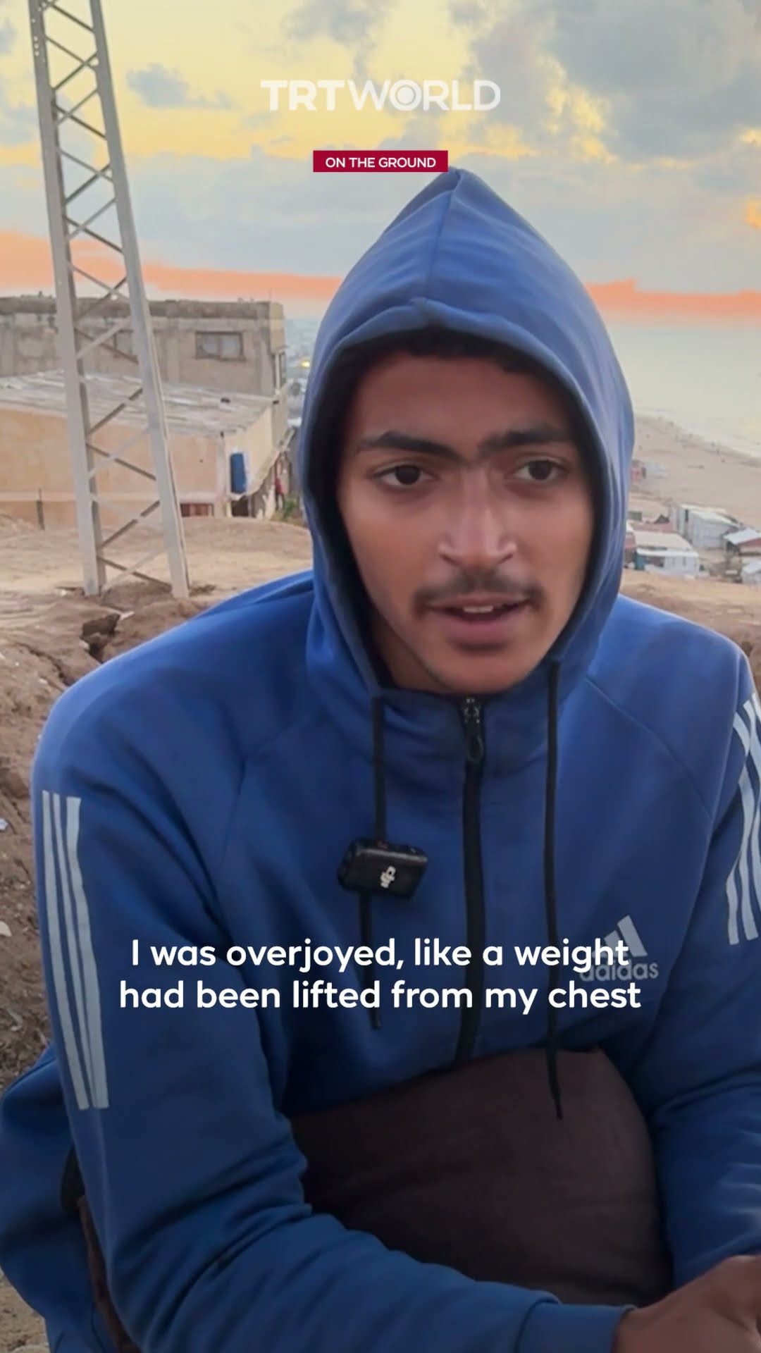 Displaced Palestinian clings to books as he awaits return home near Netzarim