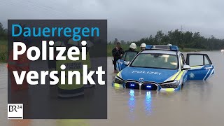 Dauerregen in Bayern: Polizeiauto versinkt im Hochwasser | BR24