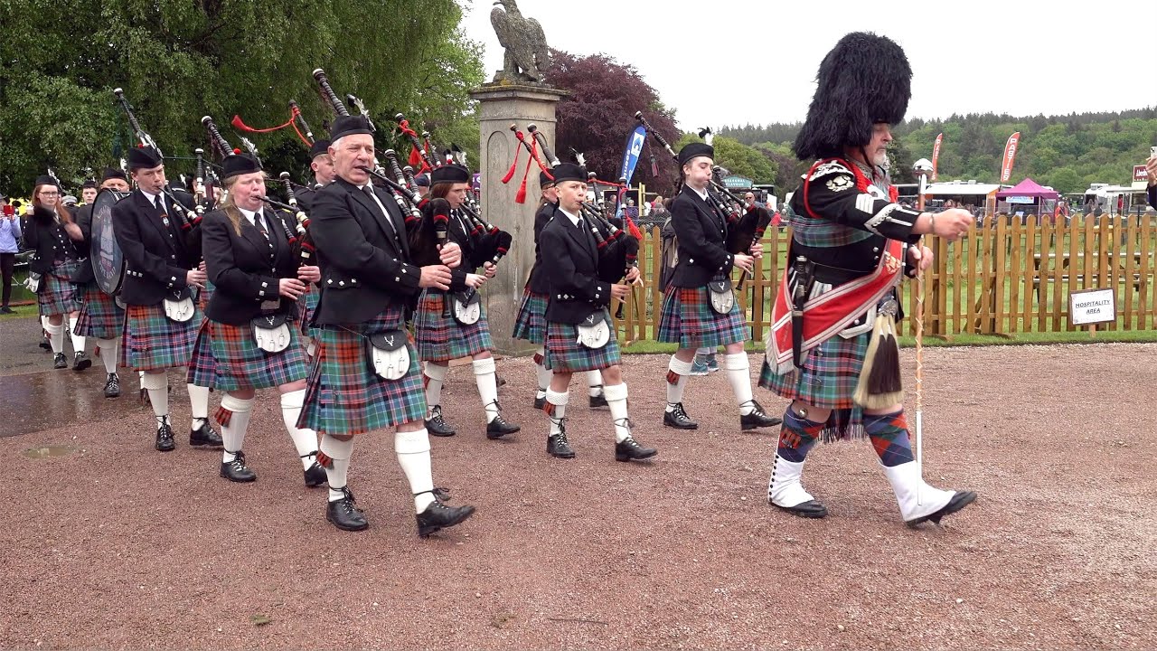 Strathisla Pipe band march in playing Bonnie Dundee during the 2023 Gordon Castle Highland Games