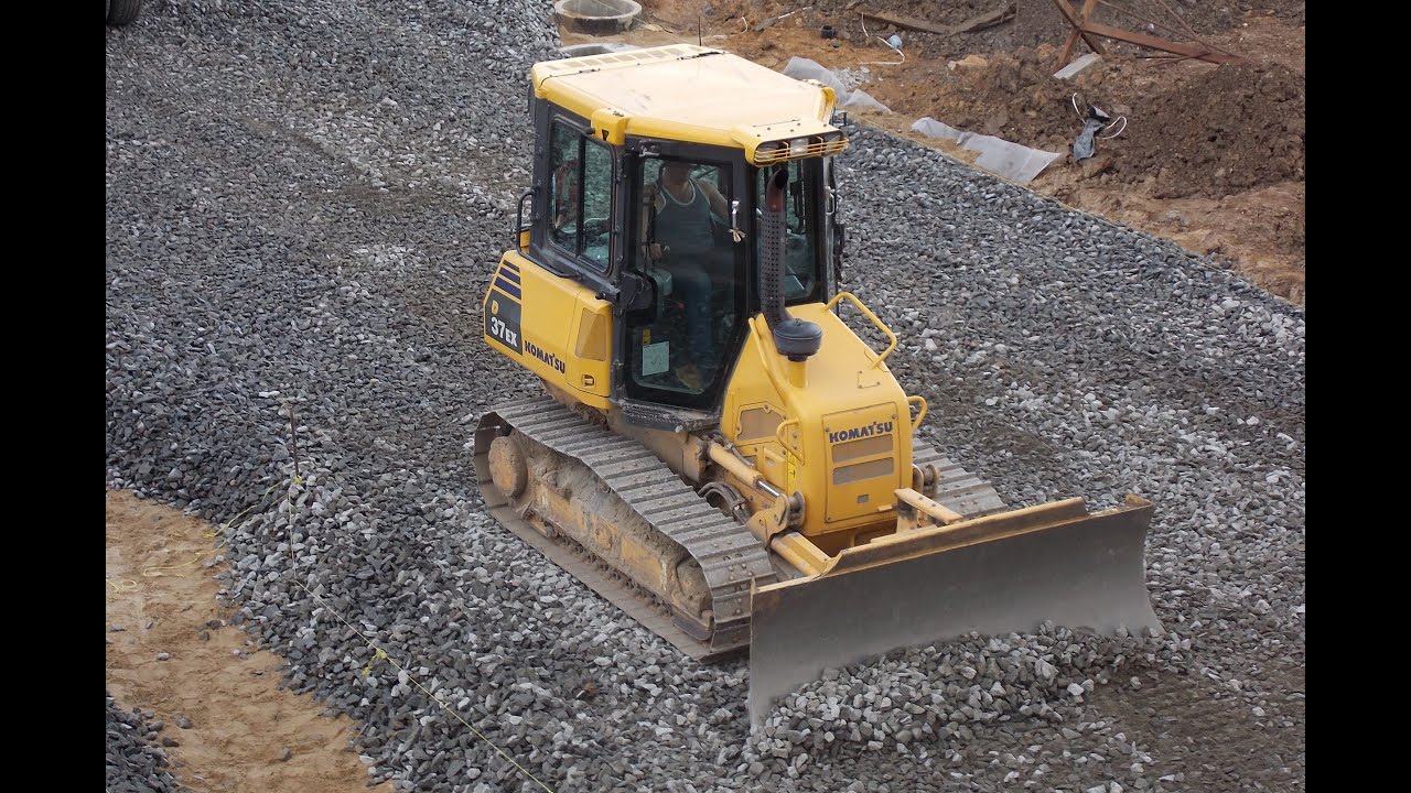 Komatsu D37EX-22 spreading gravel part 3 (a view from above)