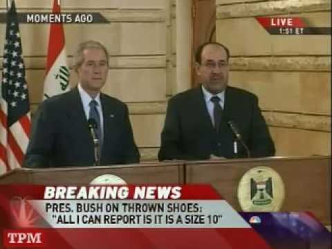 President George W. Bush dodges shoes thrown at him by Iraqi journalist Muntazer al-Zaidi from Al-Baghdadia television network, during press conference in Baghdad, December 14, 2008