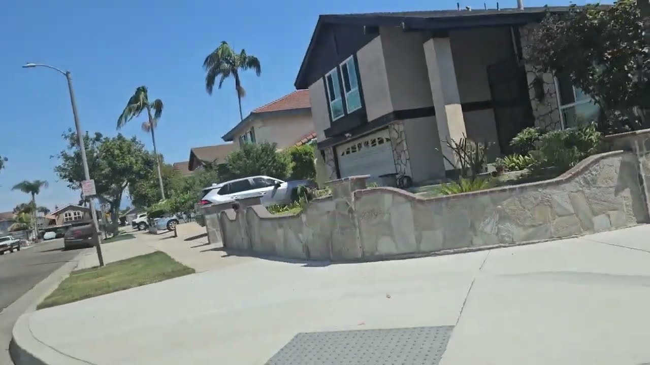 Jacquelyn Meza wearing sky blue jeans with brown belt and gray hoodie 
