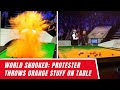 World snooker  protester throws orange stuff on table