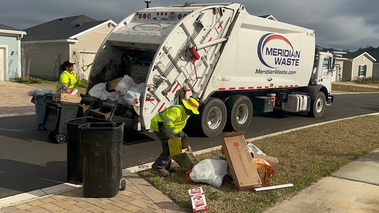 Meridian Waste Mack MRU McNeilus Rear Loader Garbage Truck Packing Post Christmas Jacksonville Trash