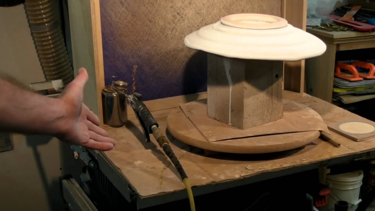 Video thumbnail of a potter spraying a pot with a mouth sprayer