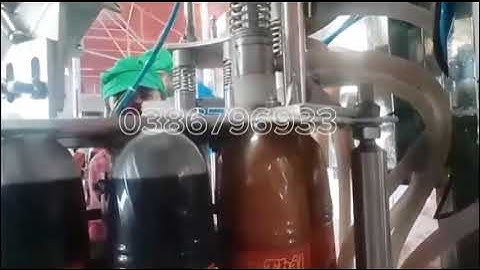 MÁY CHIẾT RÓT NƯỚC CÓ GA VÀ ĐÓNG NẮP CHAI TỰ ĐỘNG QUY MÔ NHỎ Chiết rót và đóng nắp chai tự động