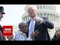 Trump shares warm moment with slain police officer's family - BBC News