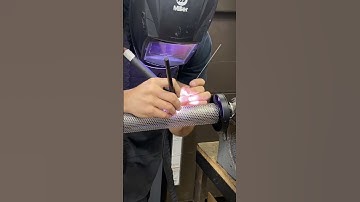 Fabricating perforated muffler cores for motorcycle racing exhausts . 🏁