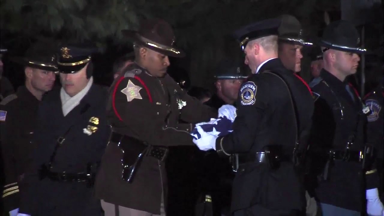 Flag is removed from Dep. Pickett's casket and Amazing Grace is played