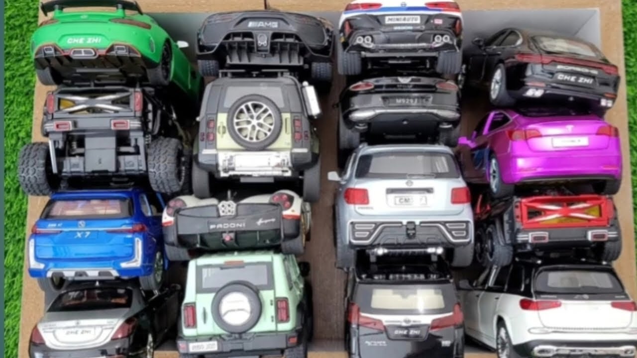 Коробка, полная литых моделей автомобилей: Maybach GLS600, Nissan Patrol, Tank300, пикап Benz, Po...