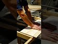 Cutting and shaping neat wooden boards using an electric table saw machine to craft furniture