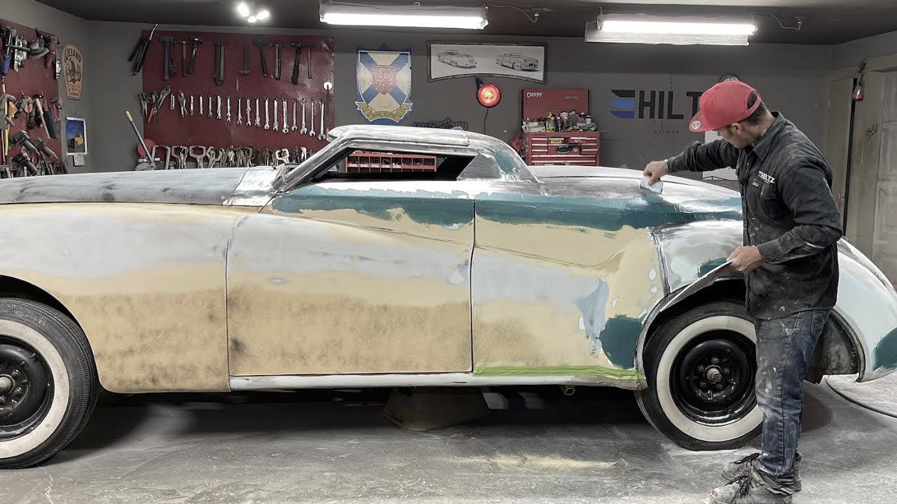 BODY WORK applying fibreglass reinforced filler over all welds 1959