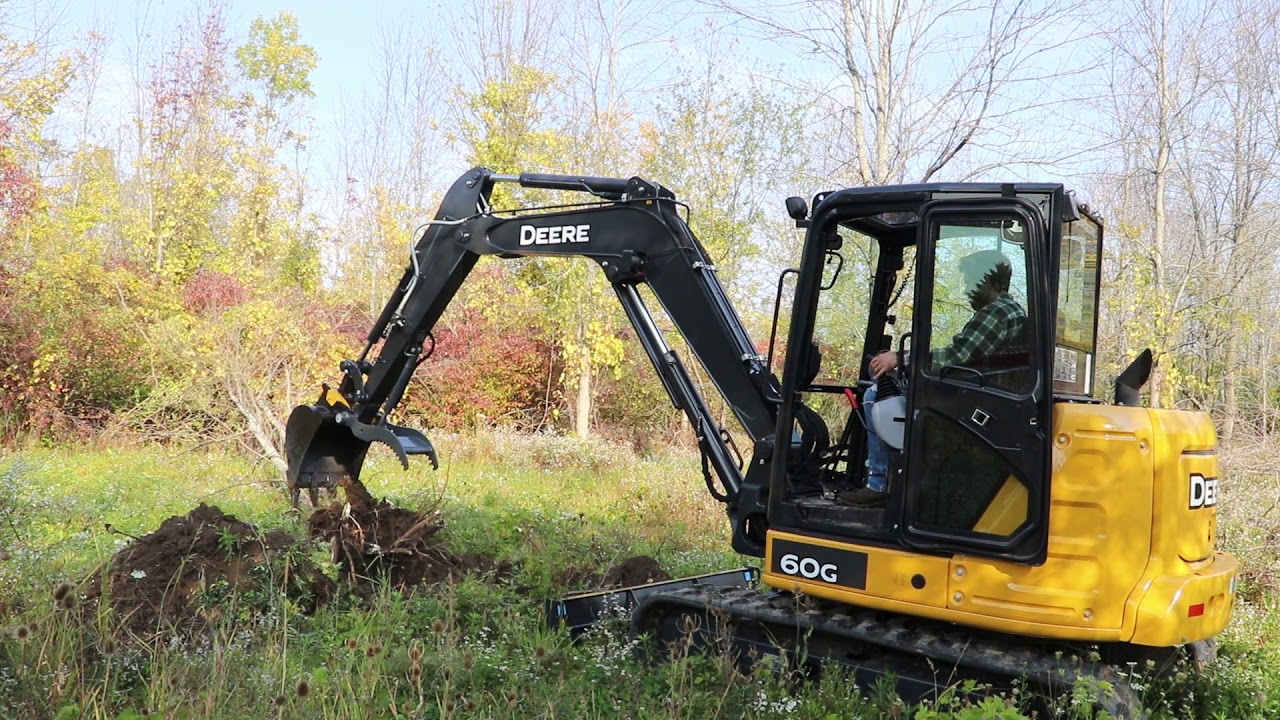 Deere 60G Excavator Fueling Up & Knocking Trees Over