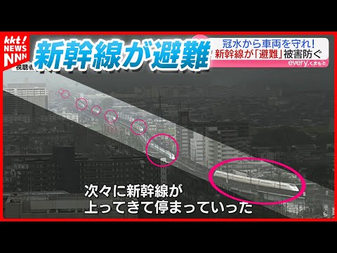 Shinkansen trains evacuated during record-breaking rains, lining up on elevated tracks to protect...