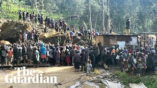 People In Papua New Guinea Dig Through Mud And Debris After Huge Landslide