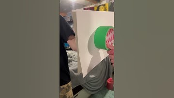 How is this possible?￼ How can the mirror see behind the paper