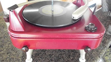 V-M record player playing a stack of 10" 78 RPM records
