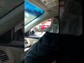 Guy jumps through car window