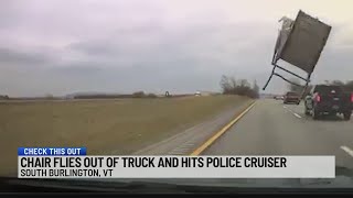 Chair flies out of truck, hits police cruiser