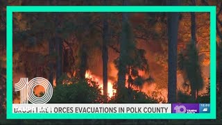 Brush fire forces evacuations in Polk County