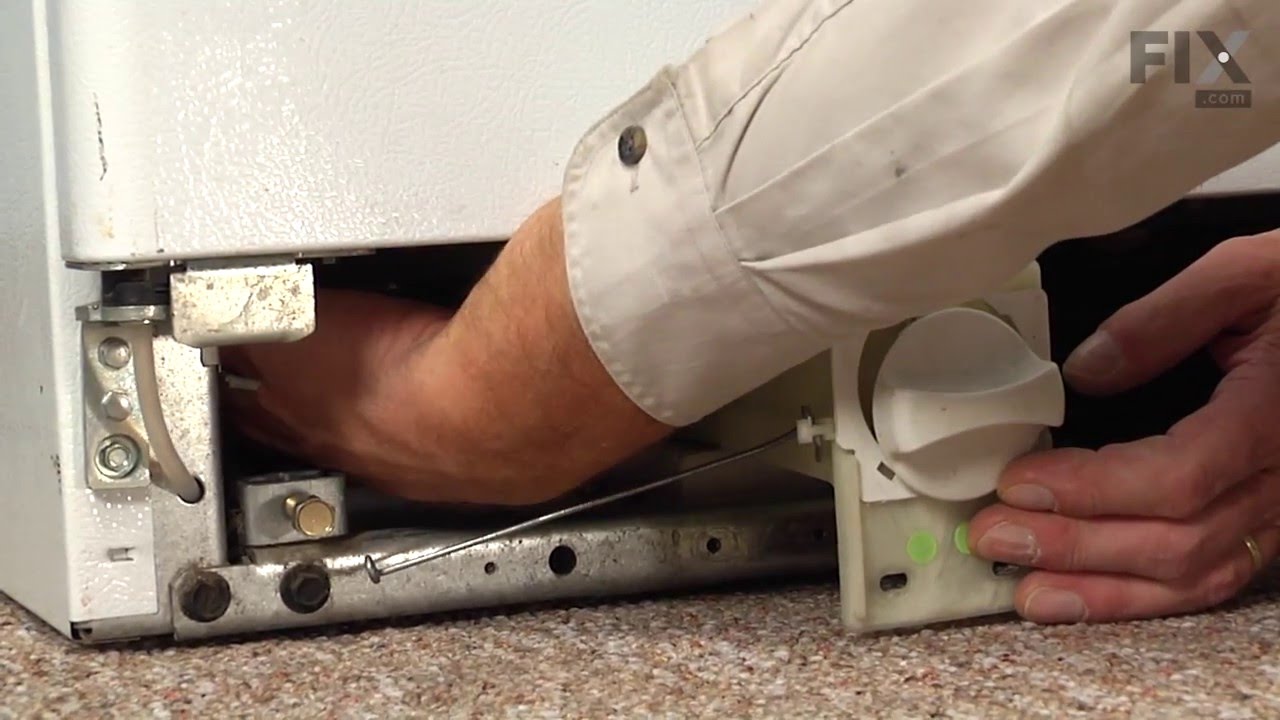 How do you remove the drip pan from a refrigerator?