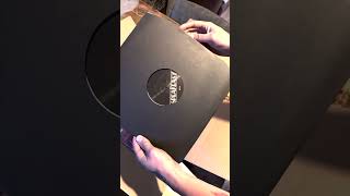 @LVDS opens his copy of The Speakeasy on vinyl