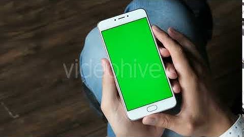 Young Man Using Phone with Mockup Green Screen | Stock Footage - Videohive