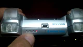 silver Dualshock 3 with bullet buttons