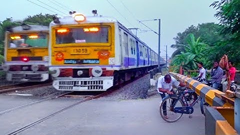 Back to Back EMU Local Train Crossing at Busy Railgate | Speedy EMU Trains Meeting at Level Crossing