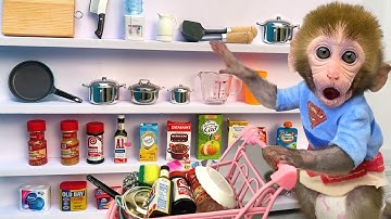 Monkey Baby Bon Bon doing shopping in food store and eat eggs with the puppy