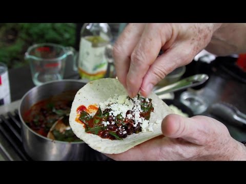 Beans and greens tacos in guajillo chile sauce with fresh cheese, from the video
