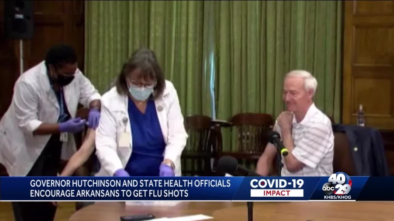 Arkansas governor and health secretary get their flu shots