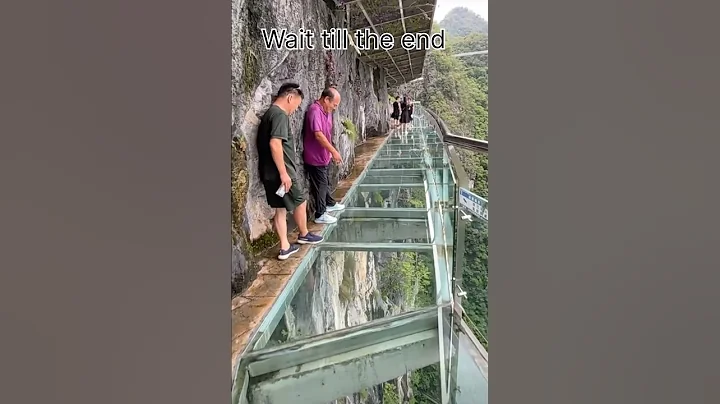 Terrifying Yet Thrilling! Walking on Glass Above the Mountains #shortsviral #glassbridge