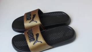 black and gold puma slides