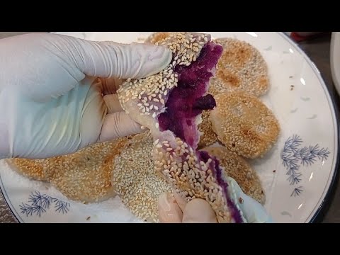 Glutinous rice flour in purple sweet potato pan fried with white sesame ...