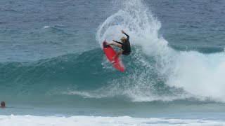 Kelly Slater and John John Florence surfing a sandbar.