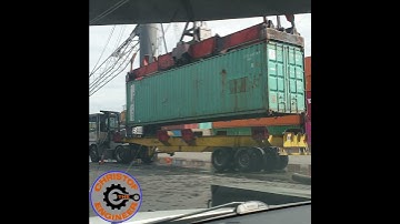 Mobile Harbor Crane dropping a 40FT Container on a Terminal Truck