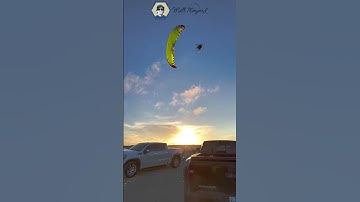 Balancing on Pole At Beach With Paramotor