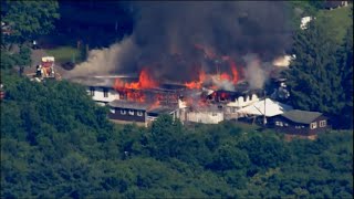Officials give update on large fire at Camp Airy