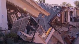 Sinkhole threatens homes