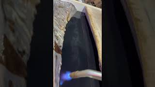 Popping bubbles on my epoxy river table pour.