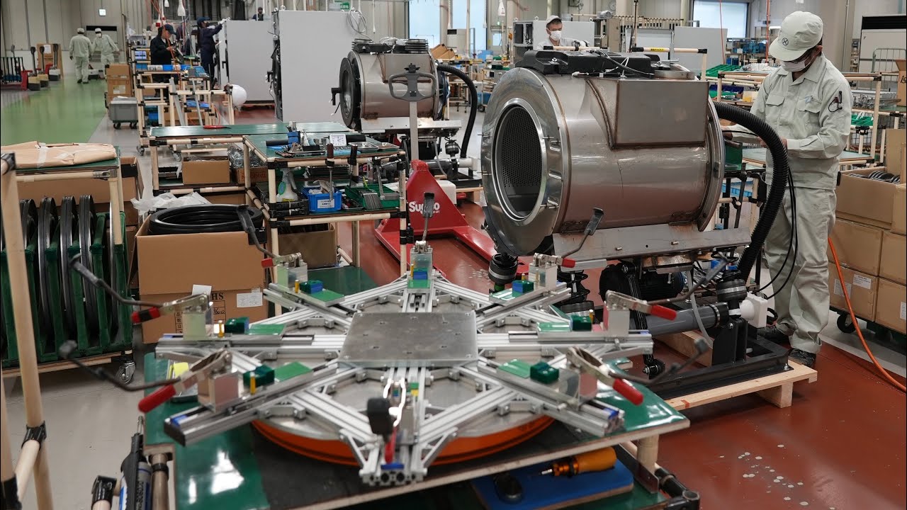 Процесс изготовления стиральной/сушильной машины с монетоприемником. Японский завод стиральных машин