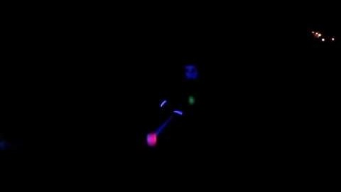 Slow motion UV LED poi bonfire party