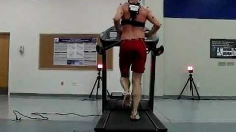 Slow Motion Treadmill Running - Barefoot Rear View