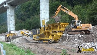 Liebherr R932 Loading Hartl Crusher and Hanomag 66C Cleaning Material