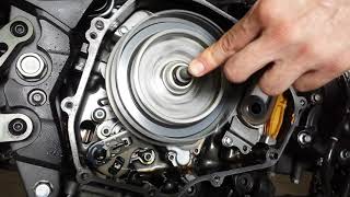Increasing oiling to motorcycle wet clutch - observing running engine with cover off.