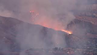 Crews battle massive brush fire surrounding homes in Riverside County