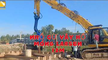 Xe đào Komatsu PC350 gắn búa rung cần dài đóng cừ larsen 12m thi công nhổ cừ vây trụ cầu