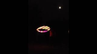 Sunset led hooping with a beautiful moon in the background